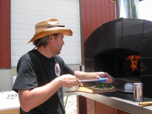 owner David White manning the pizza oven