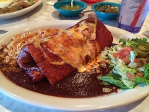 Burrito smotheres with red chile sauce--Chuy's