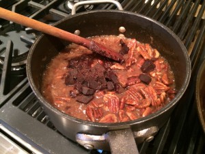 Adding chocolate to the pecan mixture